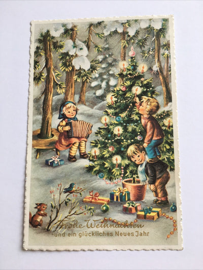 Glückwunsch Weihnachtskarten. Kinder vor dem Christbaum. 644.